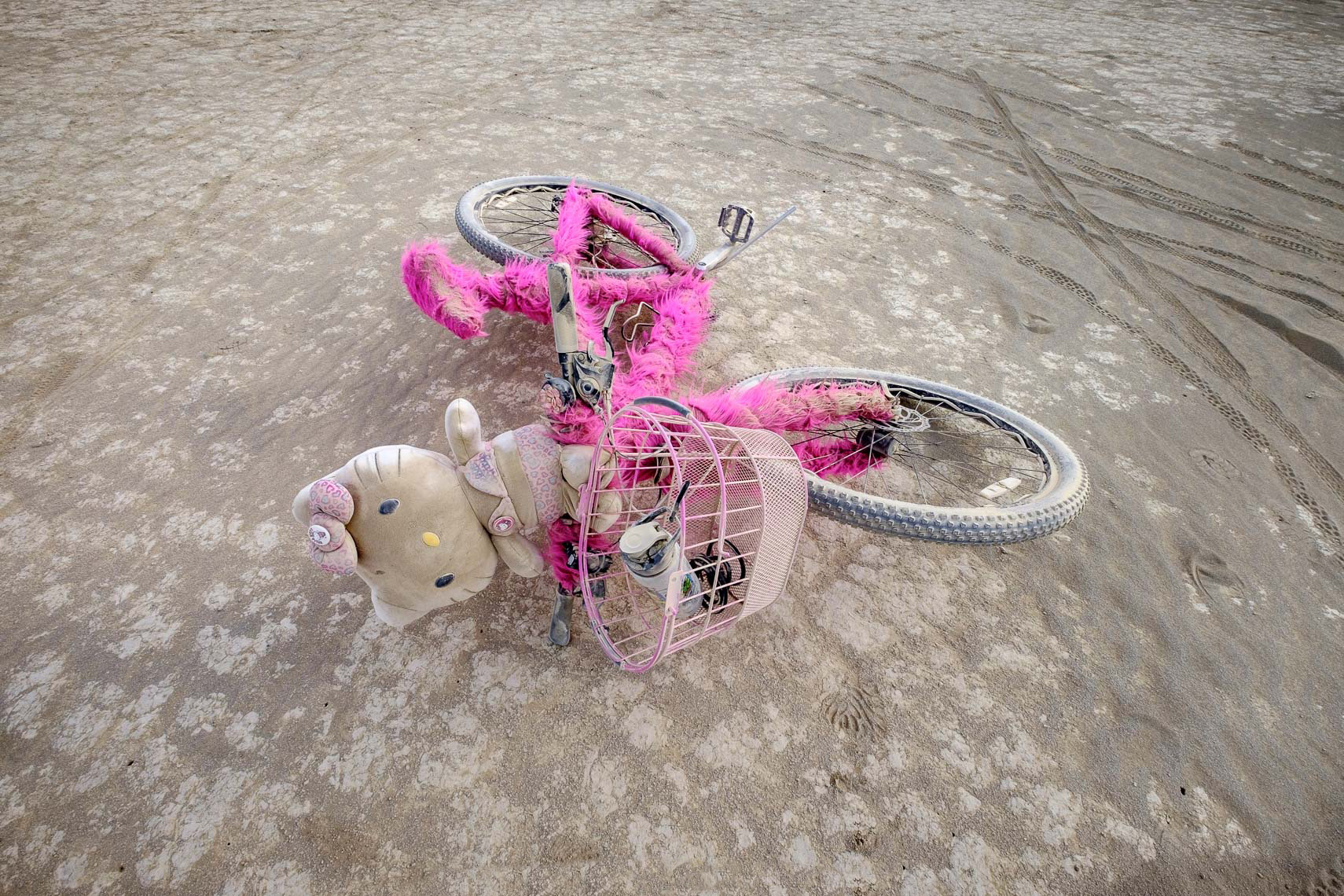 Abandoned Hello Kitty bike in deep playa-
