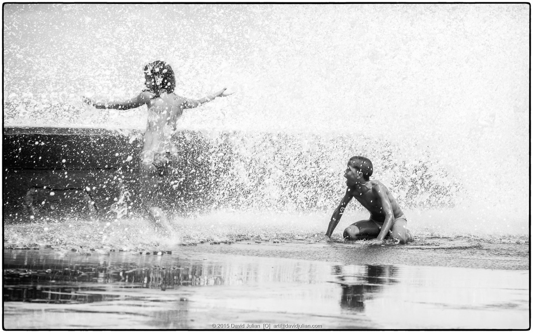 CUBA, Havana, Malecon kids in spray